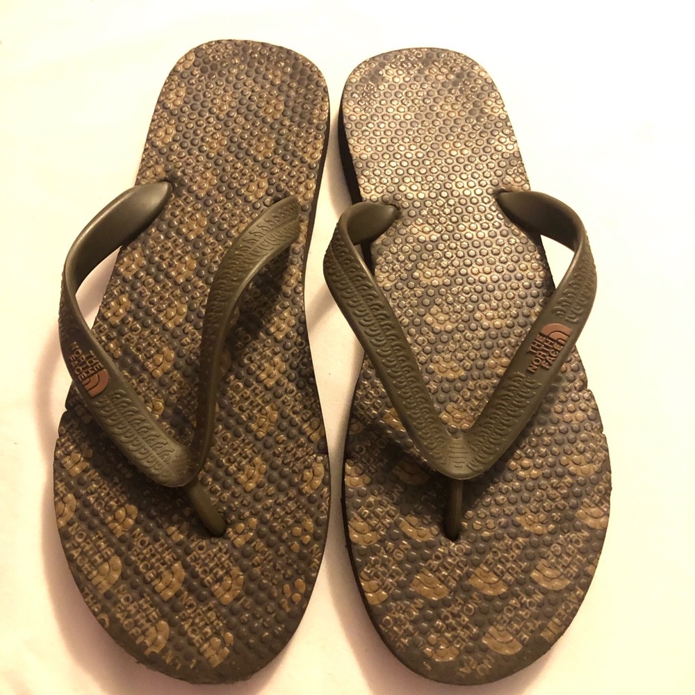 The North Face brown flip flop logo sandals
